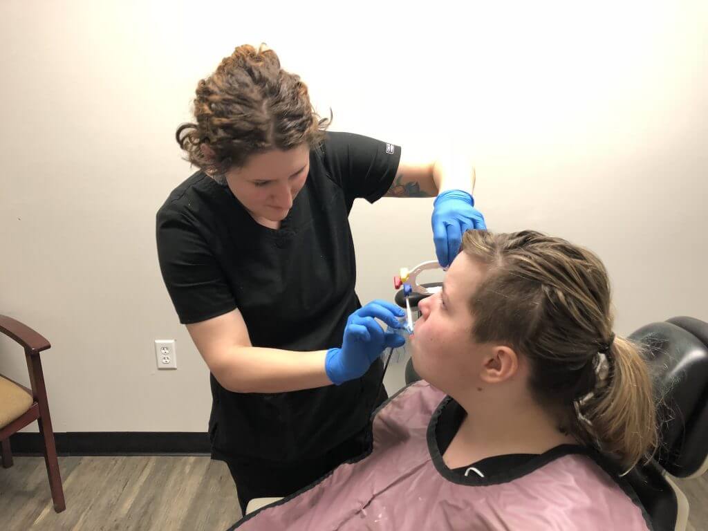 Dental assisting students practicing x-rays.